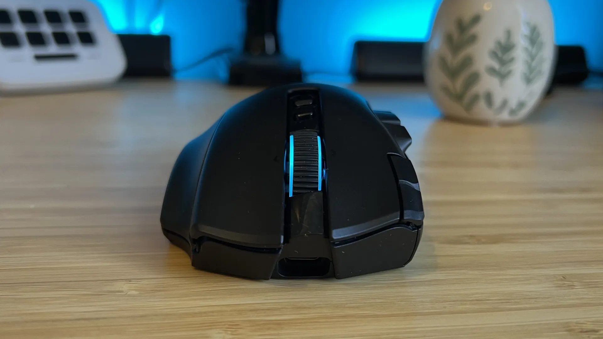 Front view of Razer Naga V3 Pro gaming mouse showing slight angled tilt towards the right side