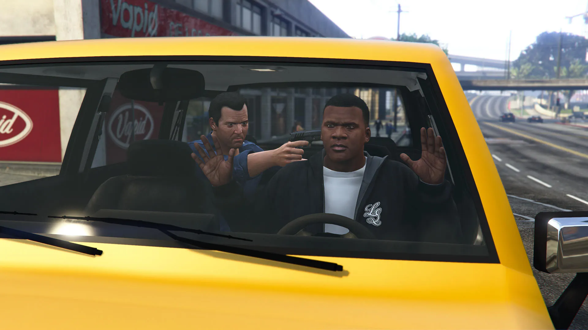 Michael holds up Franklin from the backseat of a car in GTA 5, in the early mission where they meet