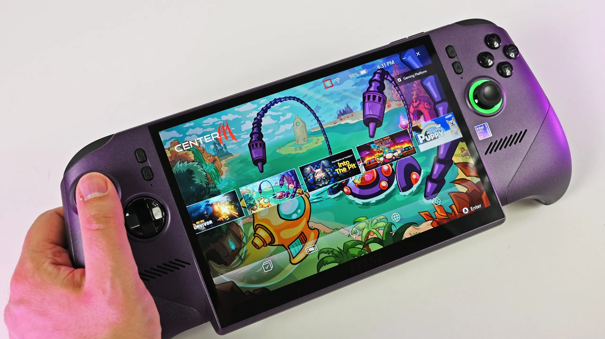 A person holds the metallic purple MSI Claw 8 EX AI+ handheld gaming PC, showcasing its large screen running the MSI Center M game launcher.