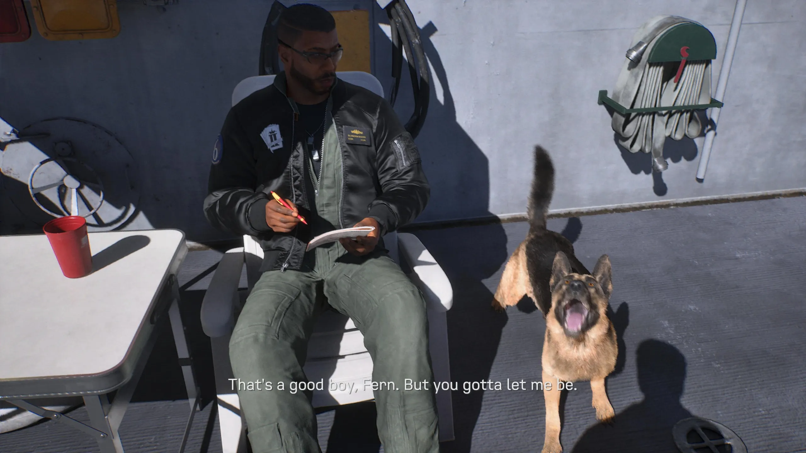 Ace Combat 8 screenshot showing Baxter sitting with a dog barking next to him