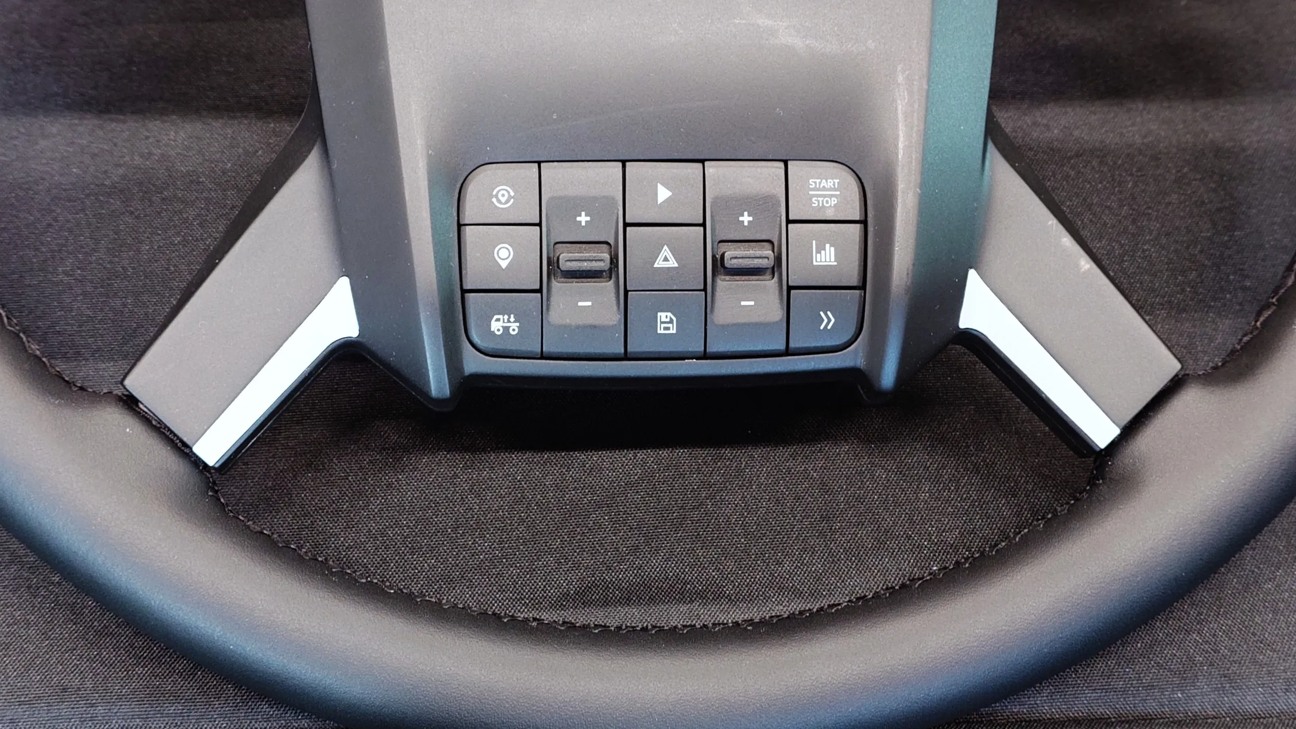 Close up photos of the new and unreleased PXN truck simulator wheel showing the design and controls.