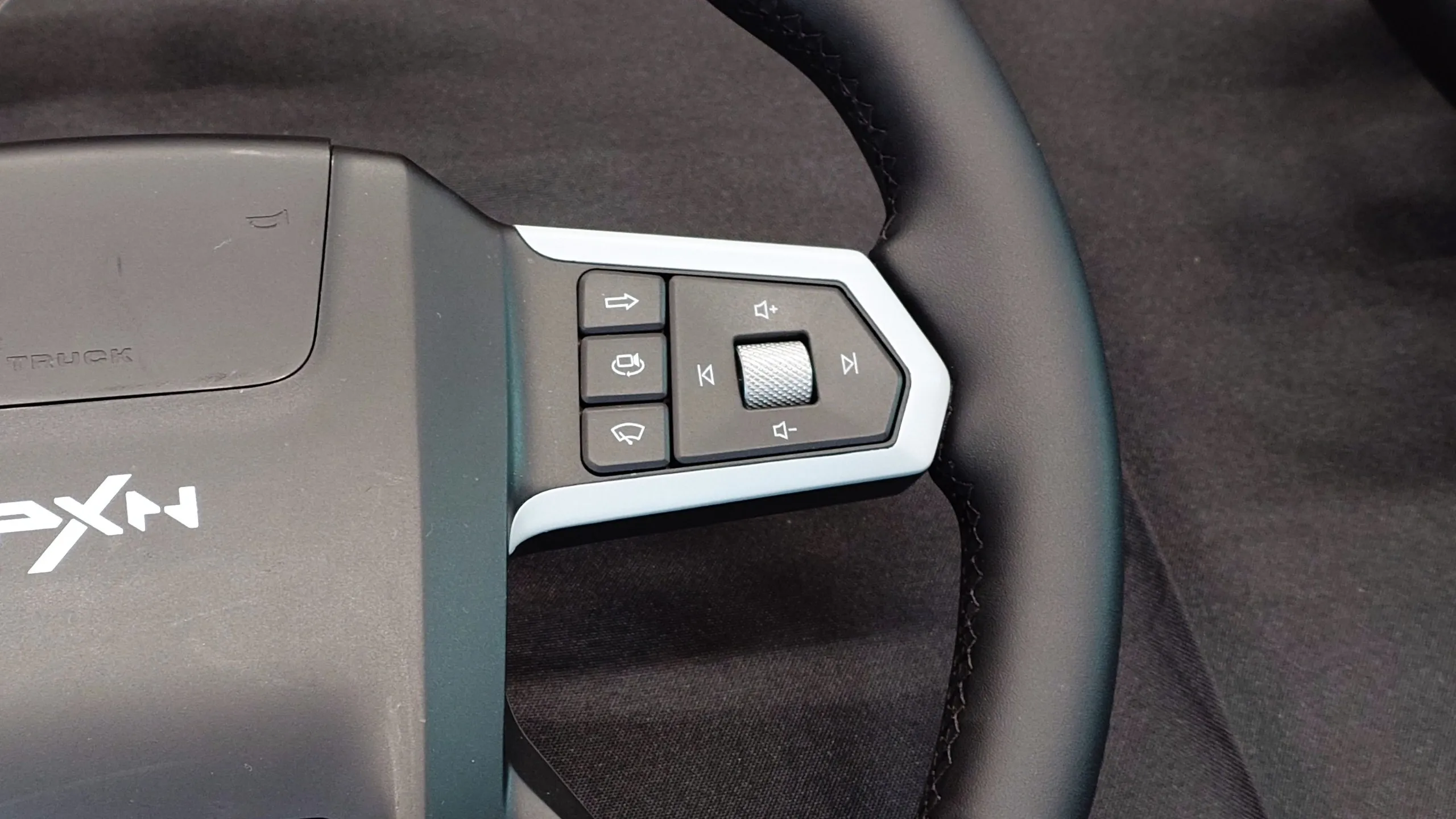 Close up photos of the new and unreleased PXN truck simulator wheel showing the design and controls.