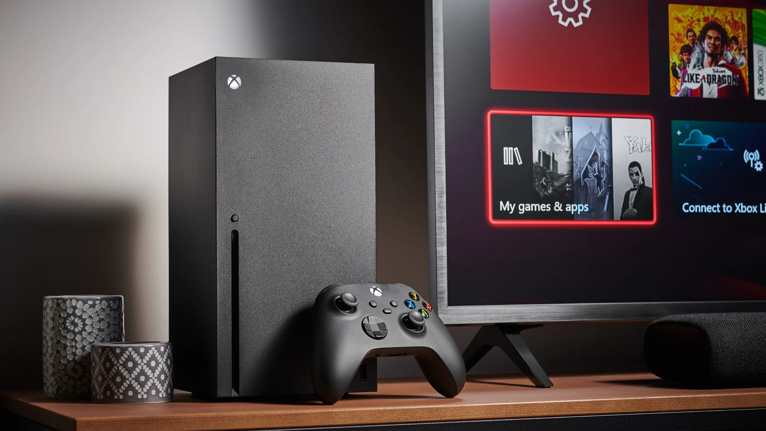 Living room with a Microsoft Xbox Series X home video game console alongside a television and soundbar, taken on October 9, 2020.